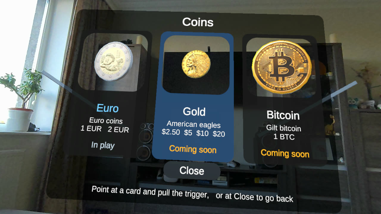 The coin sets: a card each for Euro, Gold and Bitcoin, with a real coin
                  turning in a window cut through each card