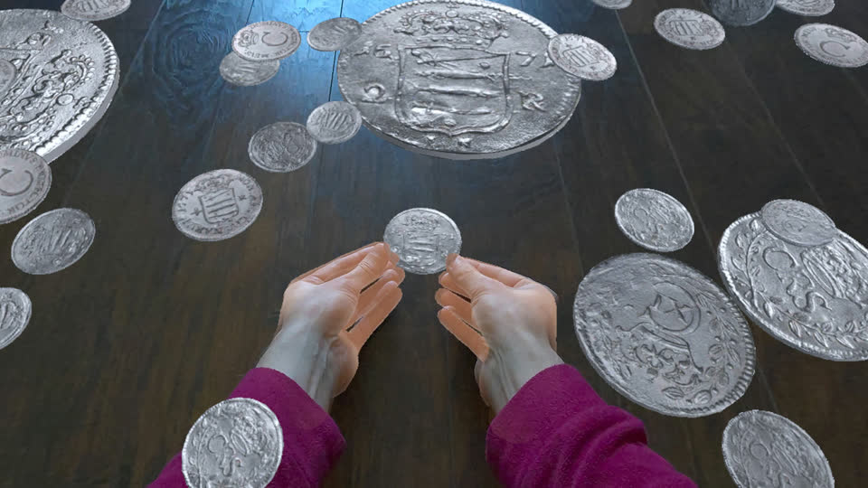 A small silver öre cupped in two hands above a floor of coins