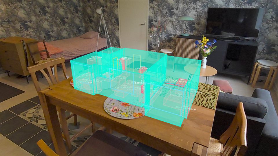 The small flat as a miniature model standing on a table